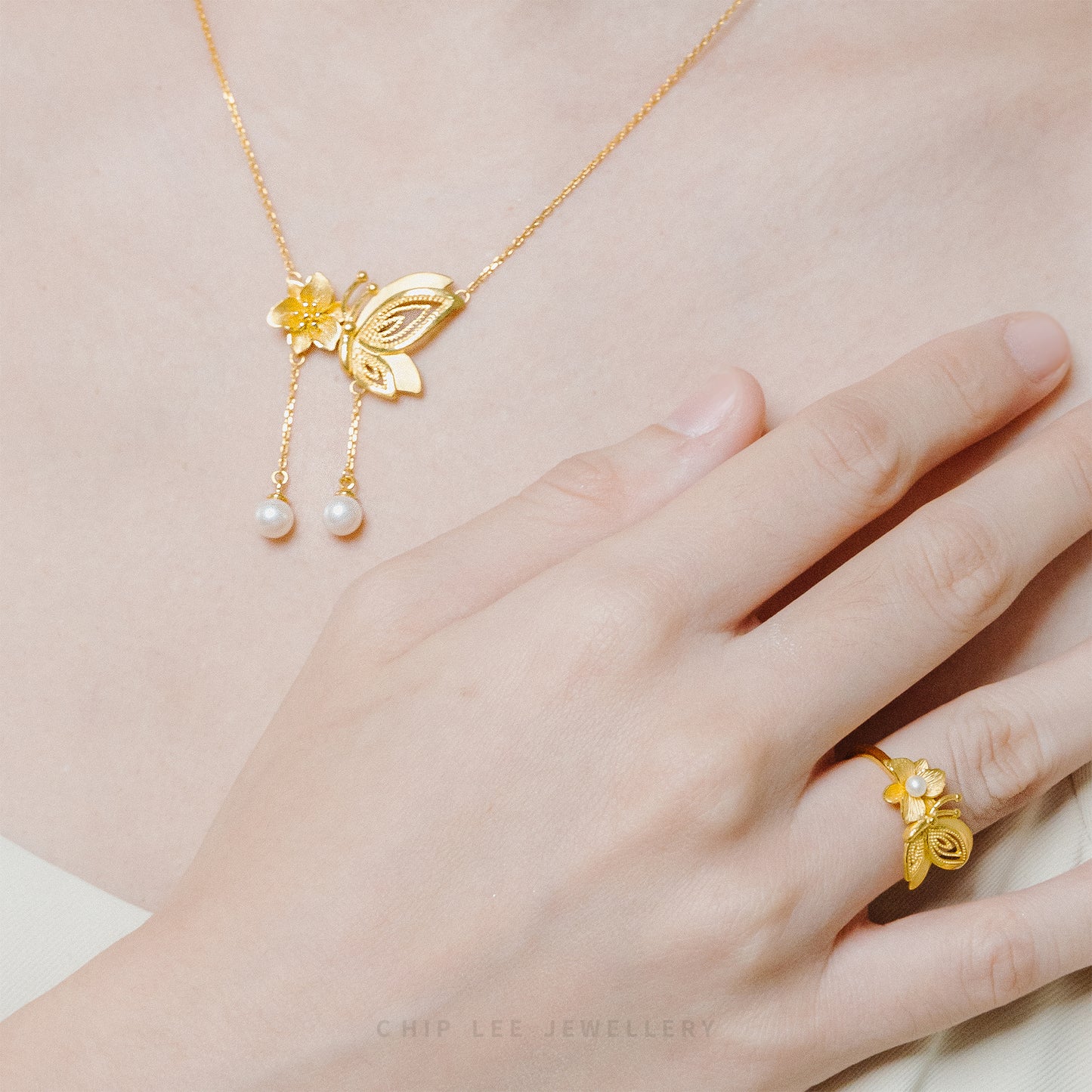 999 Pure Gold Floral Butterfly Pearl Ring with dainty floral and butterfly motifs, accented with a pearl for a touch of timeless elegance.