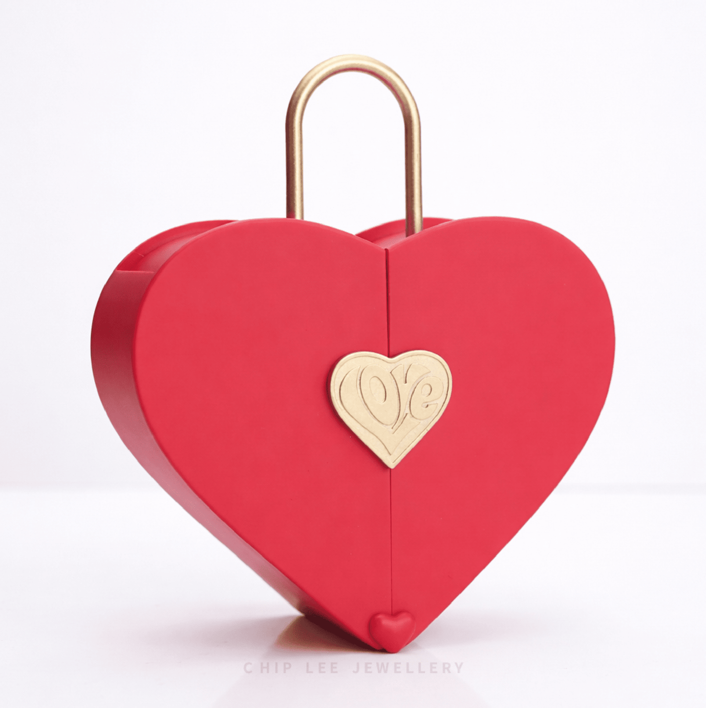 Red heart-shaped jewellery box with a gold padlock-style handle and a gold heart “Love” emblem,