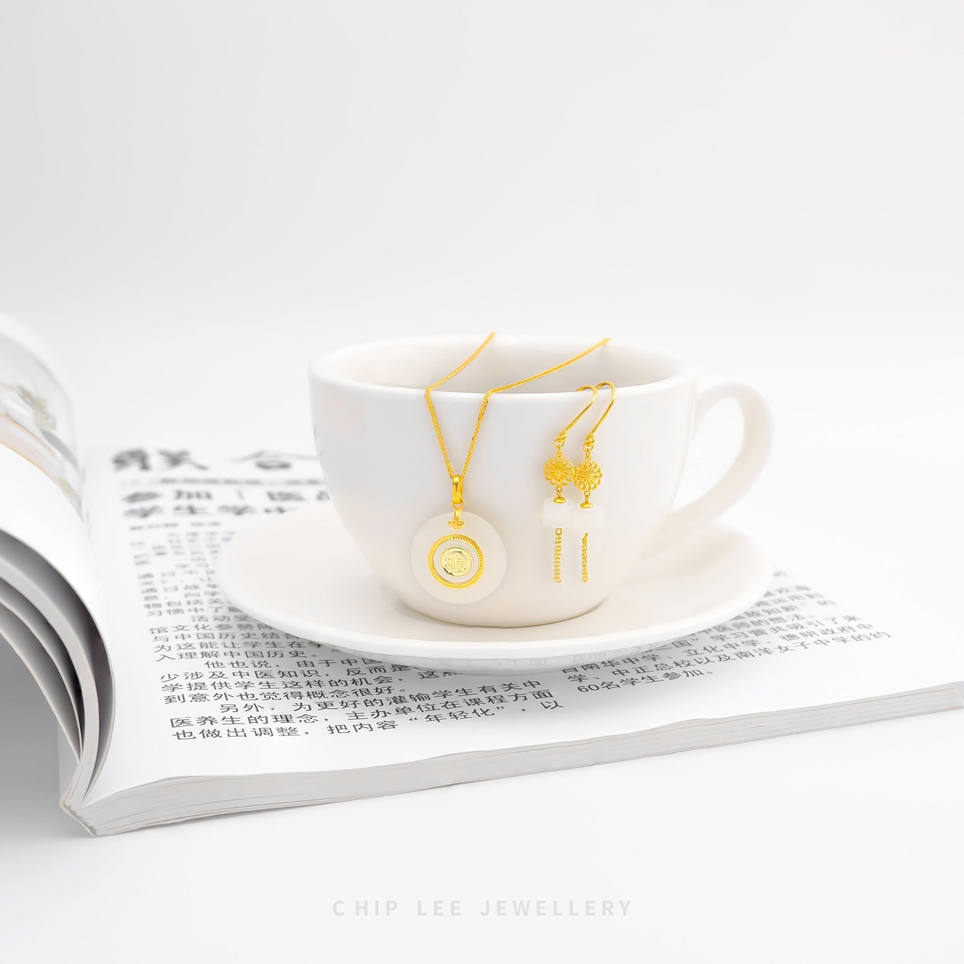 999 pure gold flower dangling earring with He Tian jade, symbolizing natural beauty and grace in an elegant, finely crafted jewellery design.