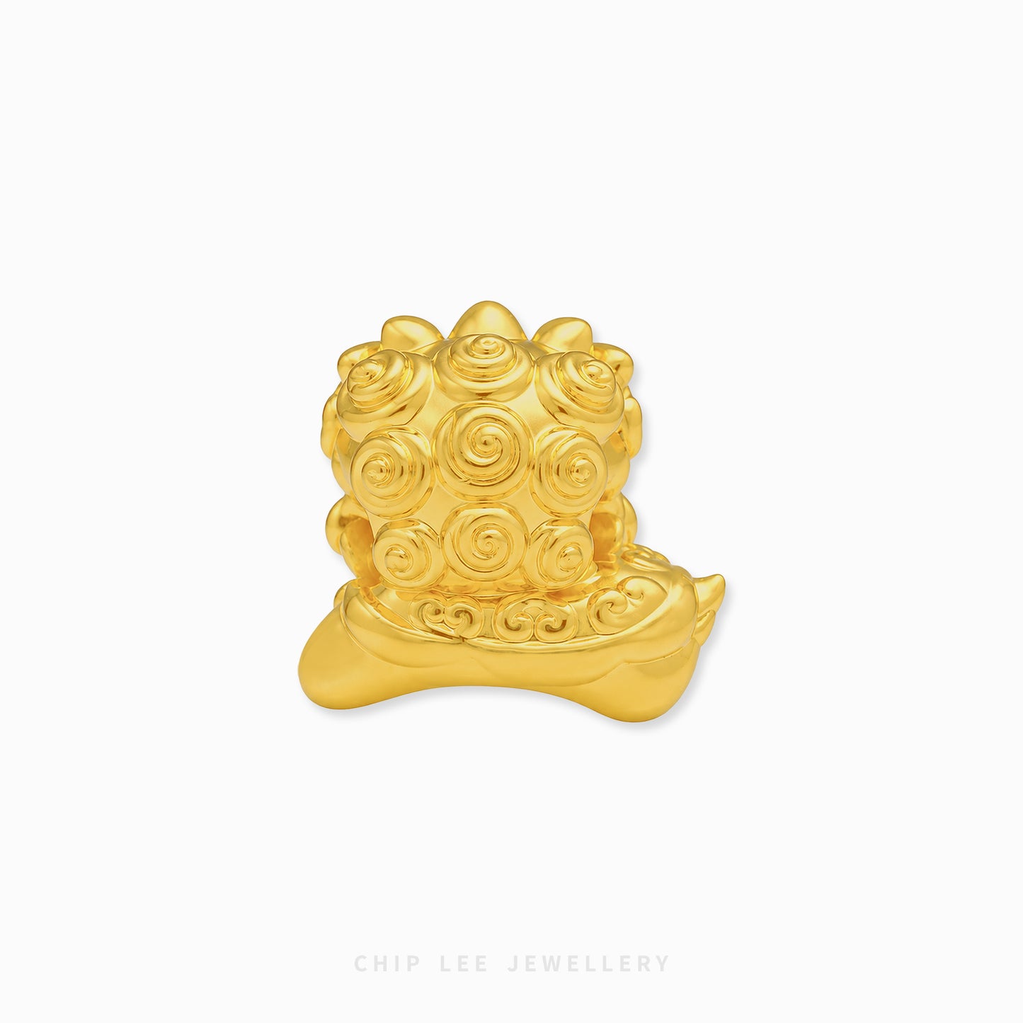 A small gold charm shaped like a traditional Chinese lion head, featuring detailed spiral patterns on its mane and a curved base, shown on a plain white background with a Chip Lee Jewellery watermark at the bottom.