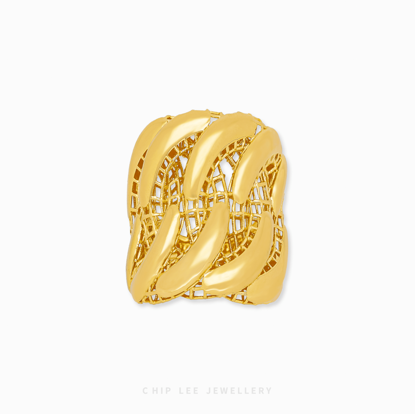 Gold ring with intricate design on a white background
