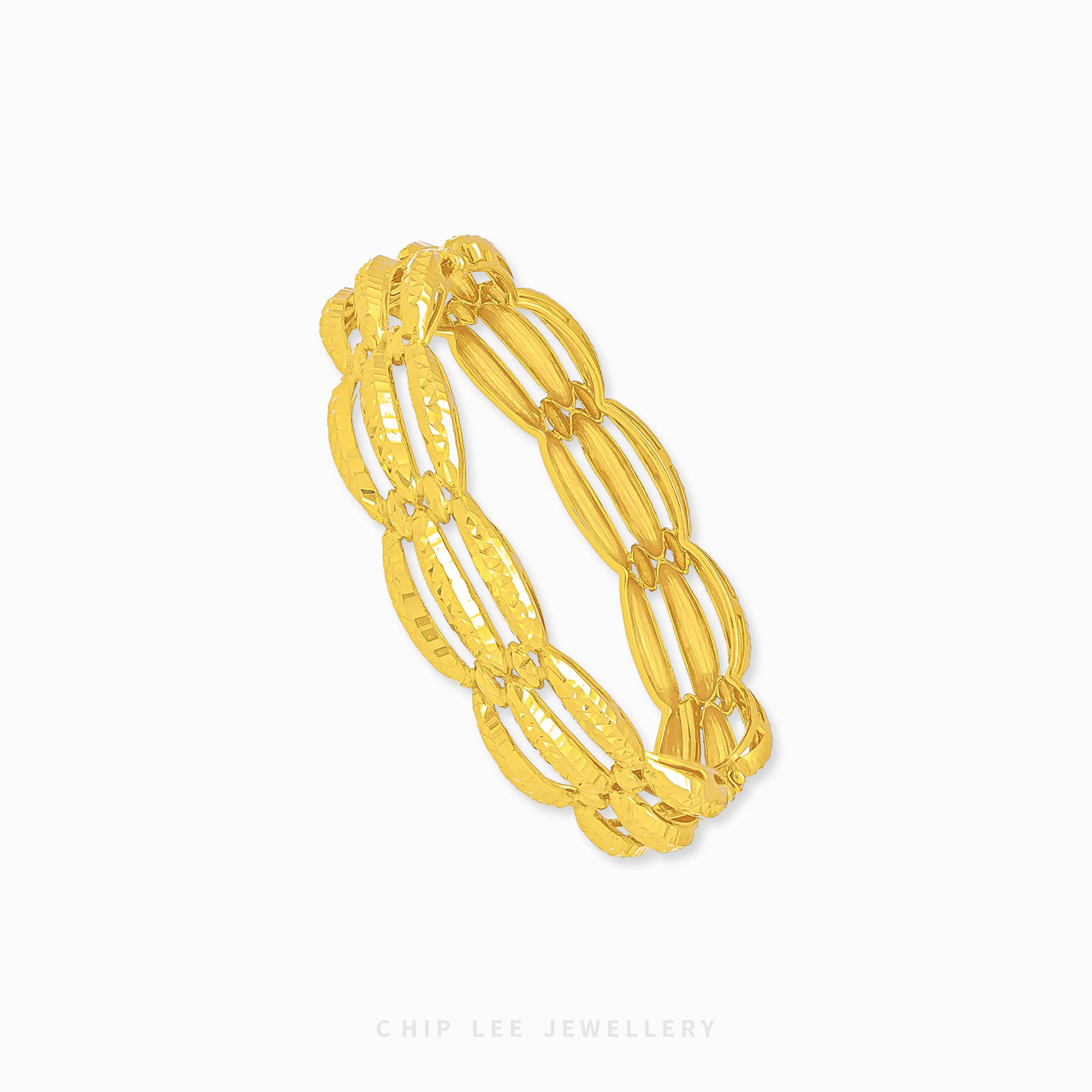 Chunky Trinity Bangle by Chip Lee Jewellery Singapore, 916/22K gold, three-tone intertwined design, symbolizes unity and strength, bold statement piece.