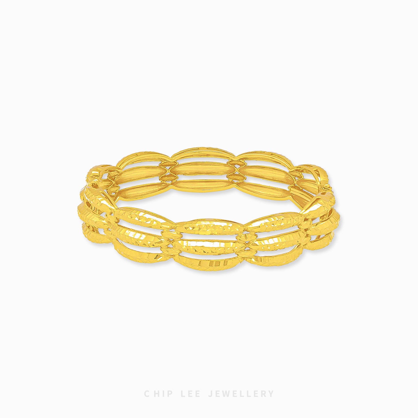 Chunky Trinity Bangle by Chip Lee Jewellery Singapore, 916/22K gold, three-tone intertwined design, symbolizes unity and strength, bold statement piece.