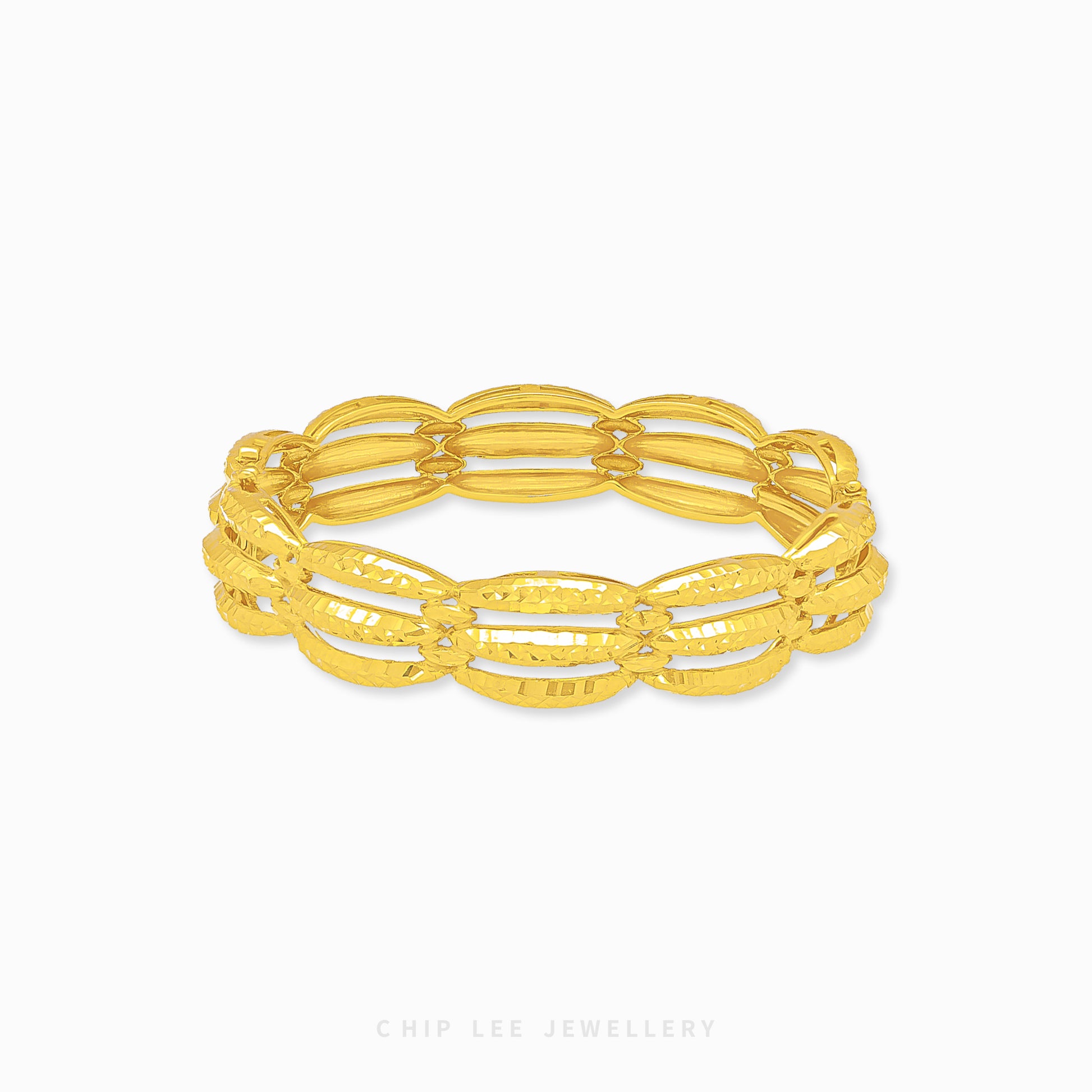 Chunky Trinity Bangle by Chip Lee Jewellery Singapore, 916/22K gold, three-tone intertwined design, symbolizes unity and strength, bold statement piece.