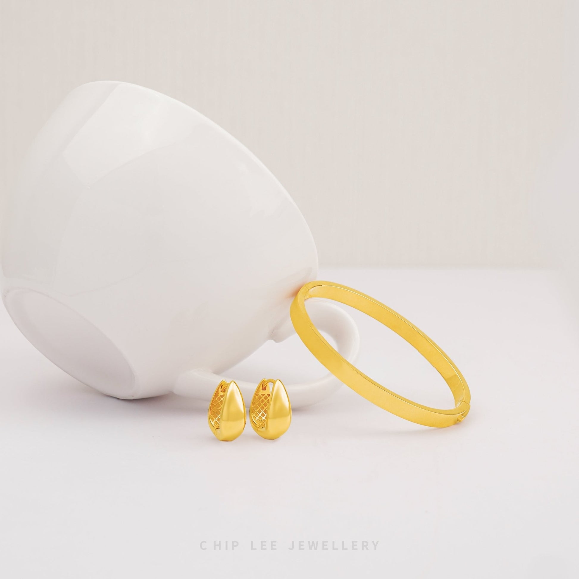 Classic Bangle by Chip Lee Jewellery Singapore, 916/22K gold, sleek minimalist design, versatile accessory for daily wear or gifting.