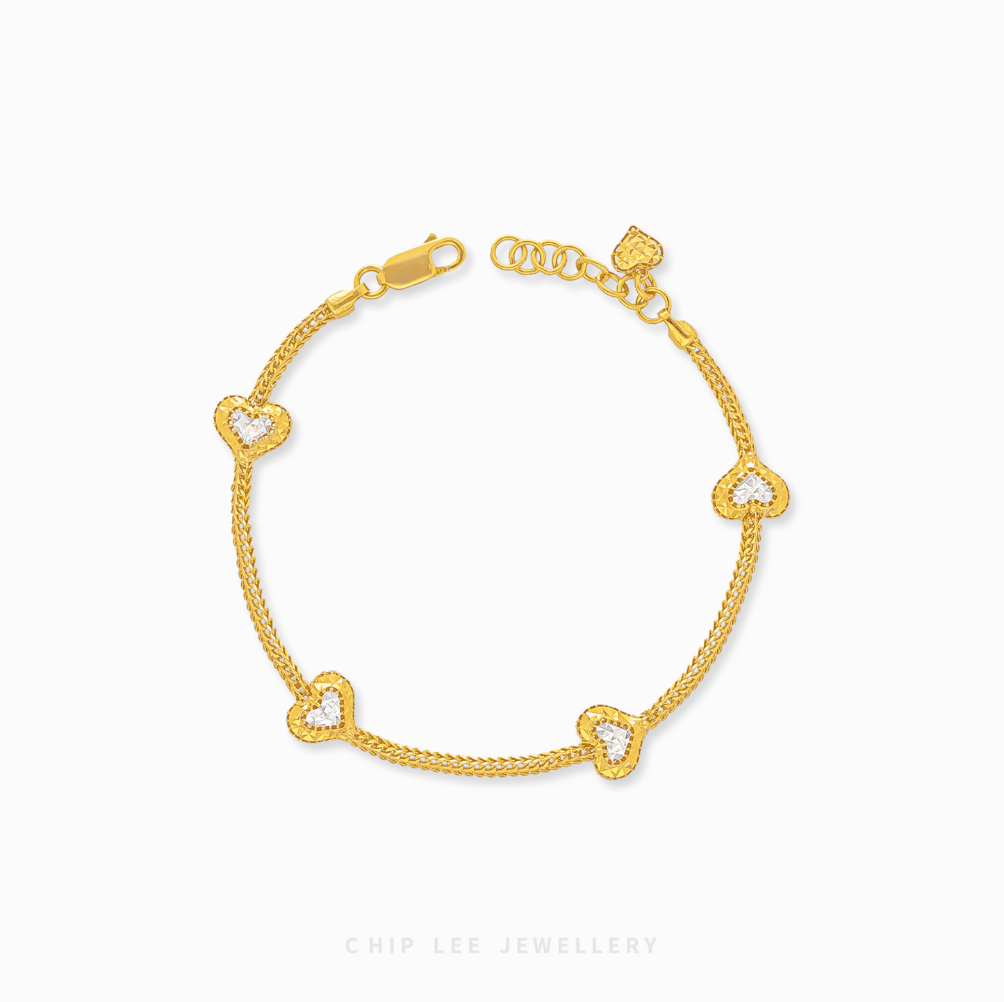 Duo Tone Heart Charm Bracelet in 916 gold. Subtle, symbolic heart design perfect for stacking or a timeless statement.