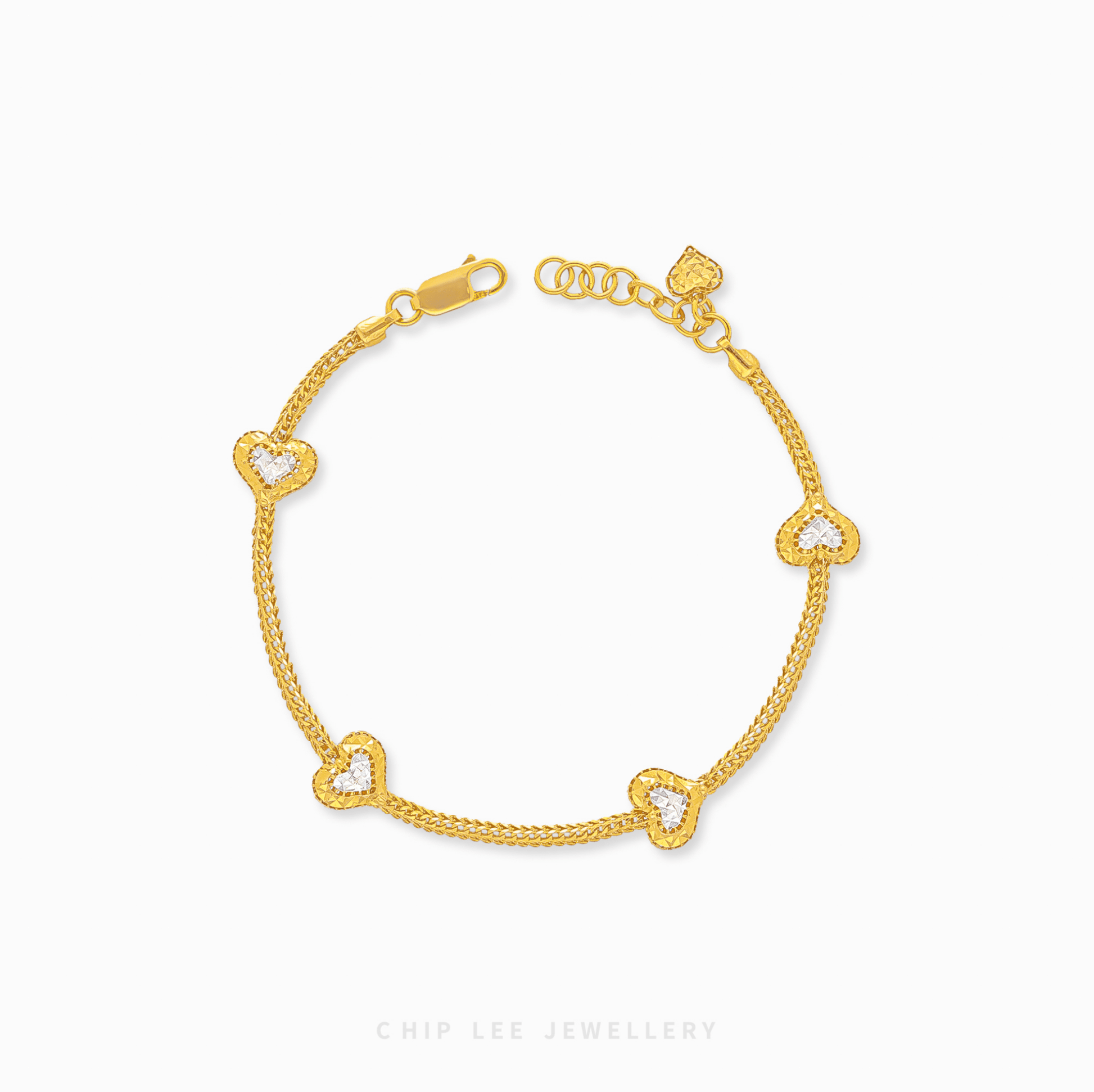 Duo Tone Heart Charm Bracelet in 916 gold. Subtle, symbolic heart design perfect for stacking or a timeless statement.