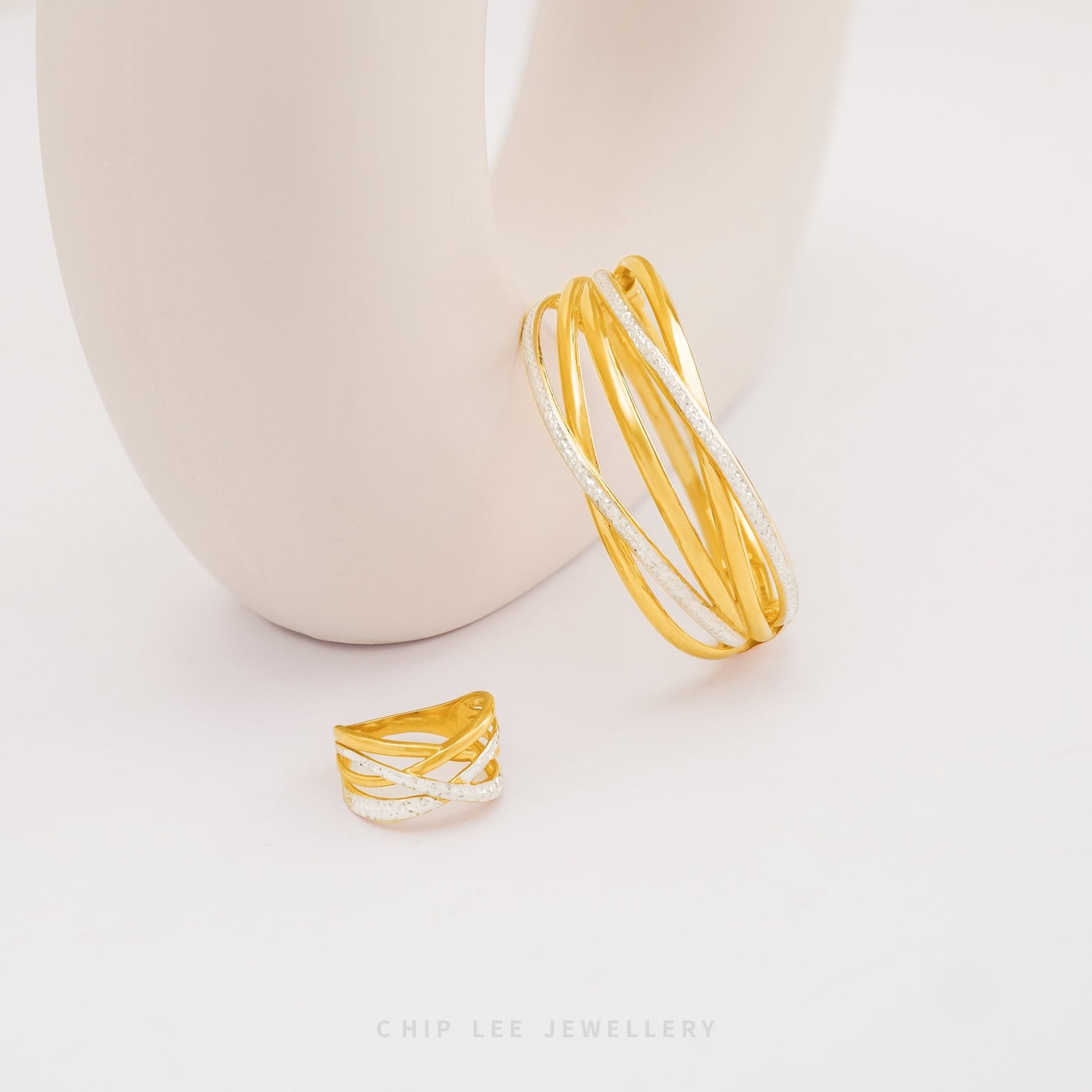 Duo Tone Helix Bangle by Chip Lee Jewellery Singapore, sculpted 916 gold with matte and high-polish finishes, bold and elegant accessory