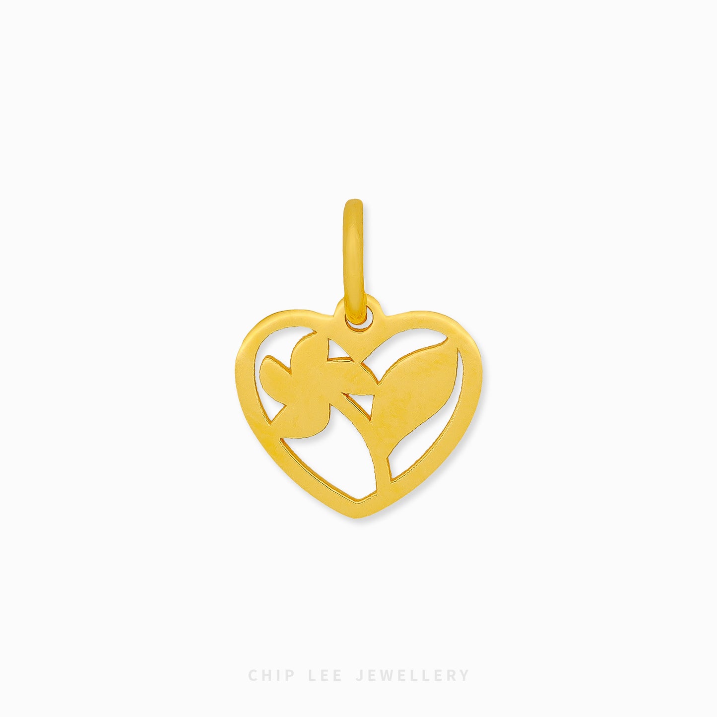 Gold heart-shaped pendant with cut-out design on a white background