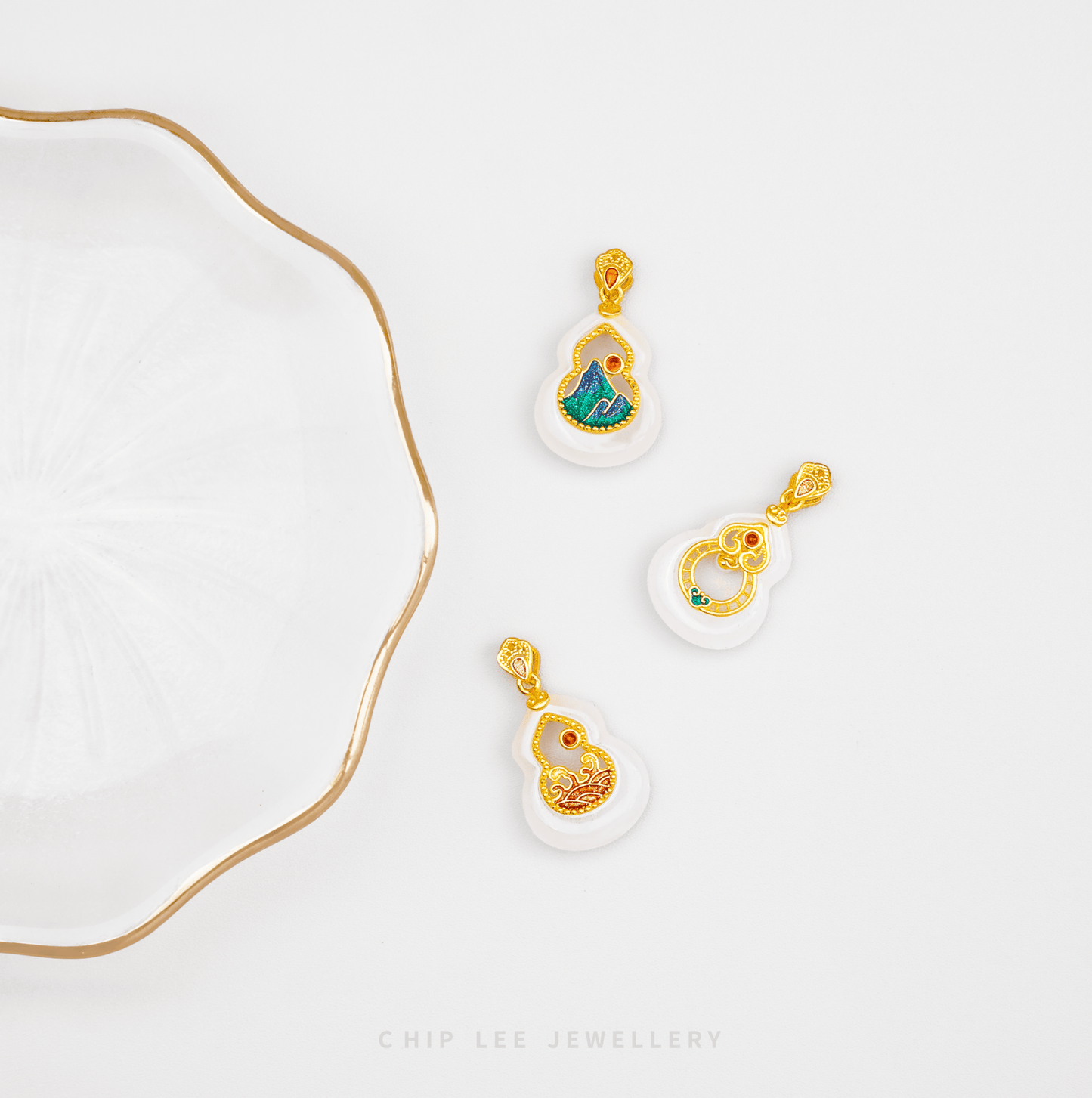 Jewelry set with gold and white pendants on a white background, featuring 'Chip Lee Jewellery'.