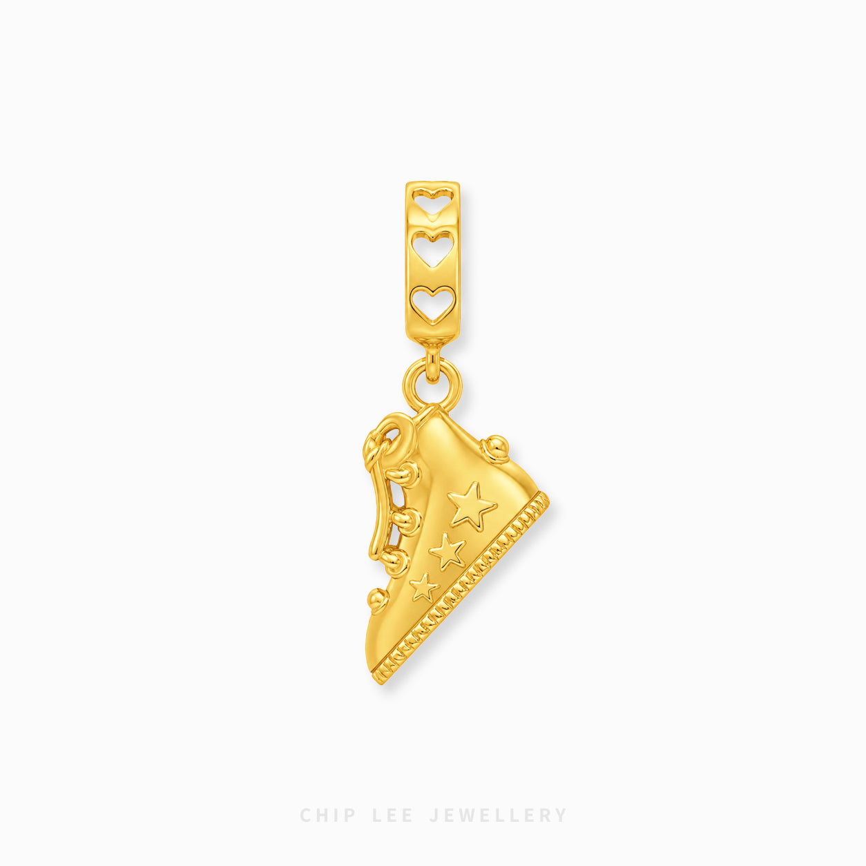 A gold charm pendant shaped like a sneaker with star details, hanging from a heart-patterned top bar, shown on a light gray background with Chip Lee Jewellery branding at the bottom.