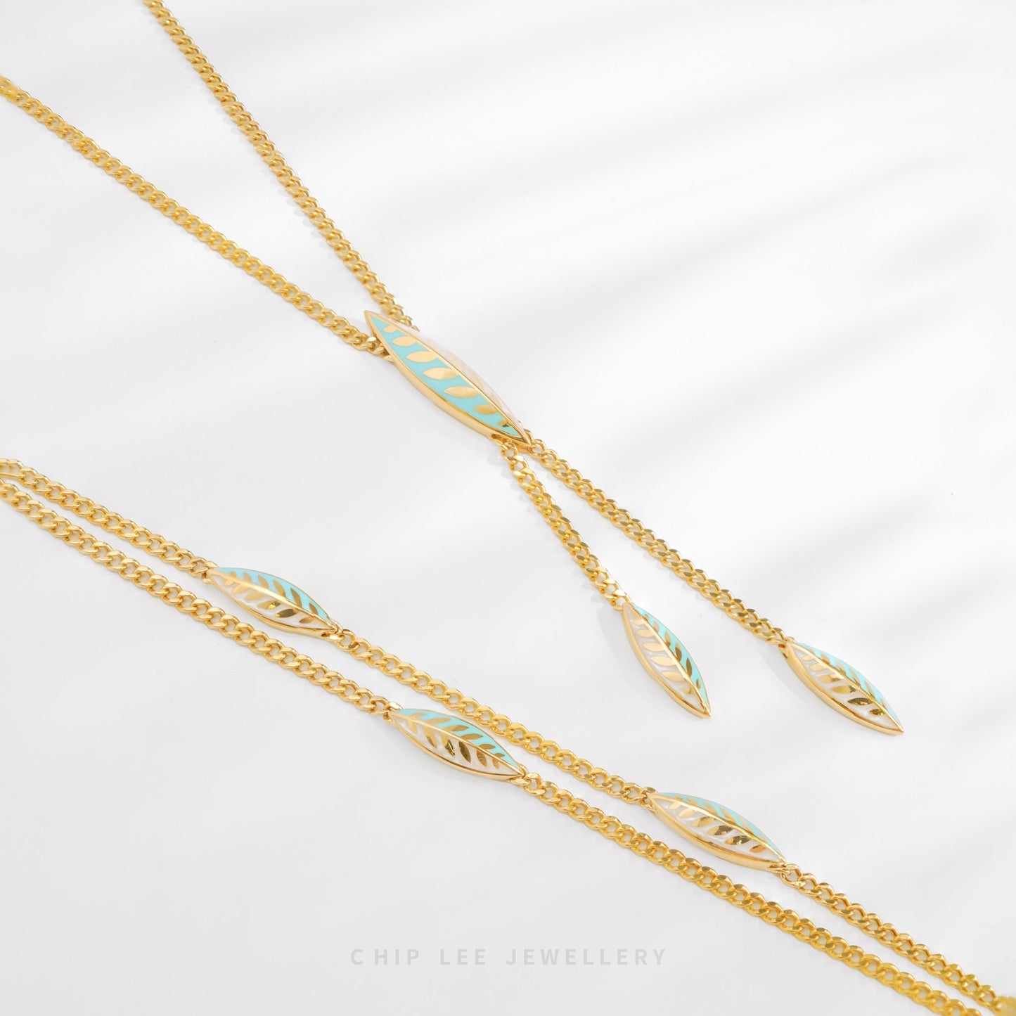 916 gold Turquoise Enamel Leaf bracelet with charm, hallmarked in SG. Lightweight and vibrant for effortless elegance.