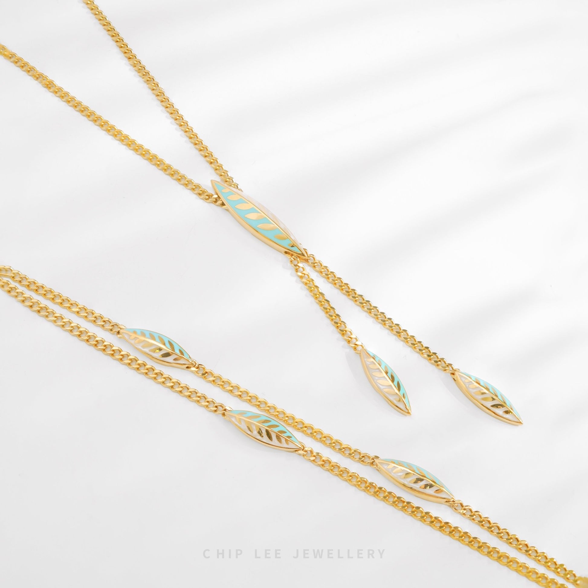 916 gold Turquoise Enamel Leaf bracelet with charm, hallmarked in SG. Lightweight and vibrant for effortless elegance.