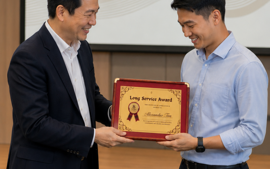 Custom 999 pure gold certificate personalised with employee name, company logo and years of service award.