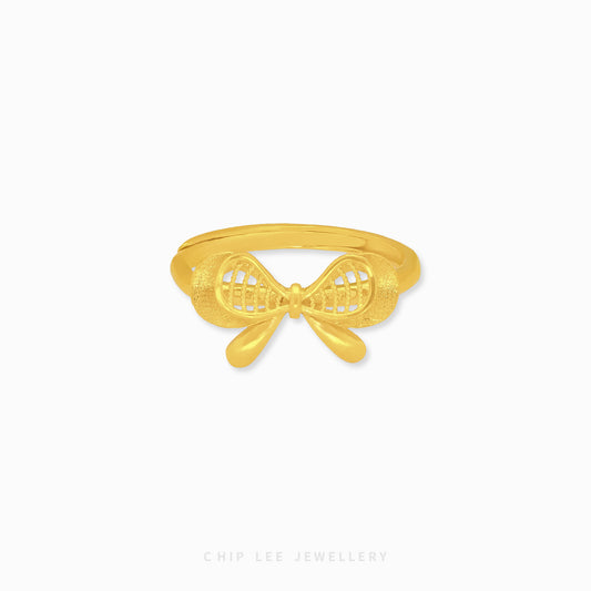 999 Dainty Ribbon Ring by Chip Lee Jewellery, 999 pure gold, featuring a delicate bow design, adding elegance to any outfit.
