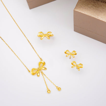999 Dainty Ribbon Set by Chip Lee Jewellery, 999 pure gold, featuring a delicate bow design, adding elegance to any outfit.