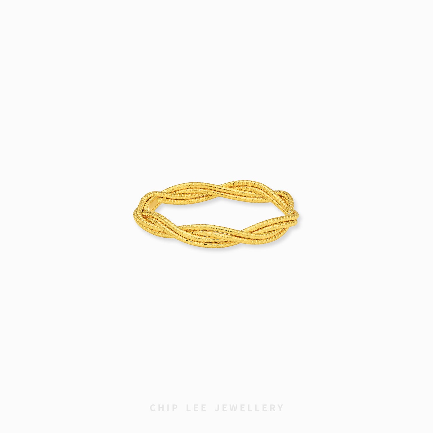 A gold twisted rope bangle bracelet by Chip Lee Jewellery, displayed on a clean white background.