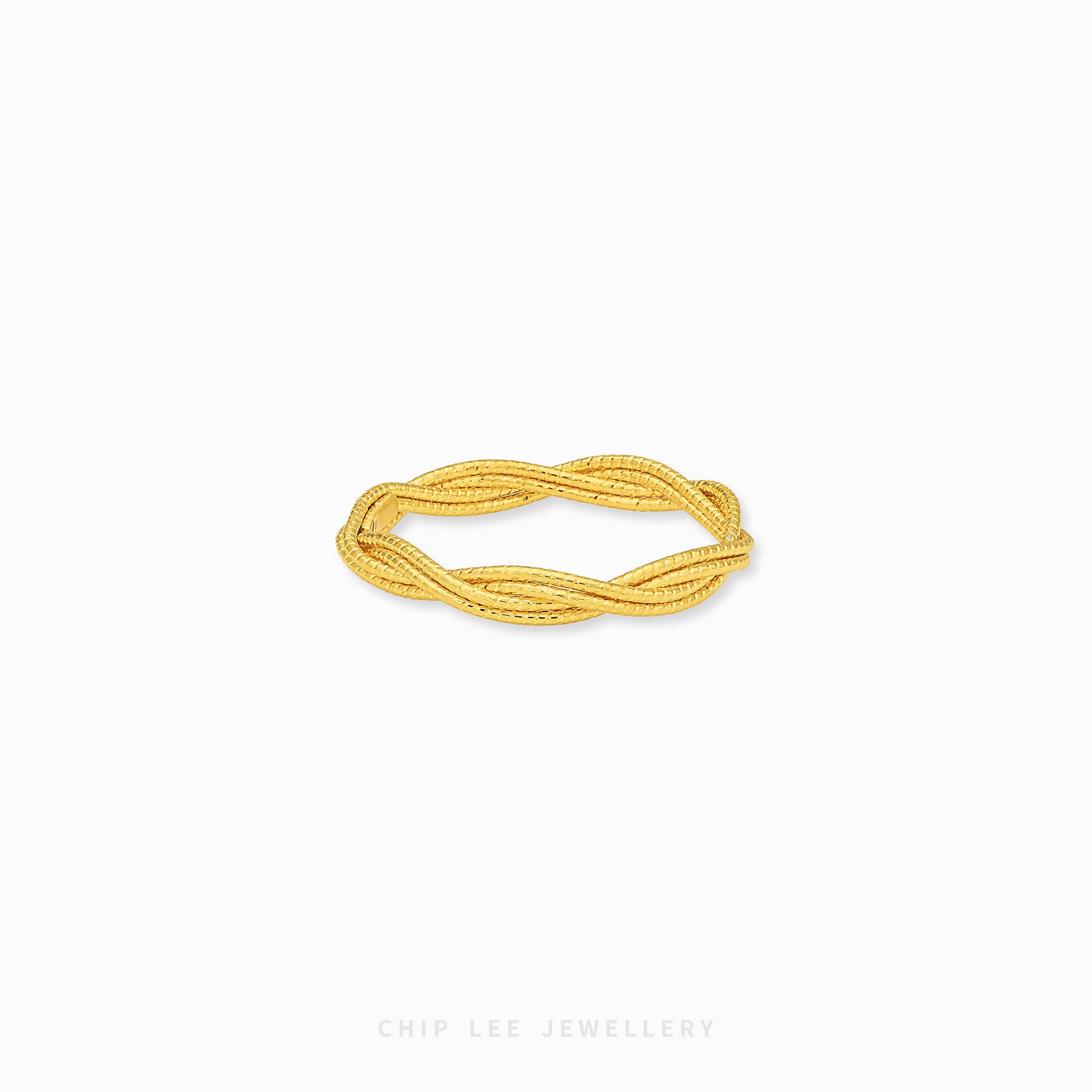 A gold twisted rope bangle bracelet by Chip Lee Jewellery, displayed on a clean white background.