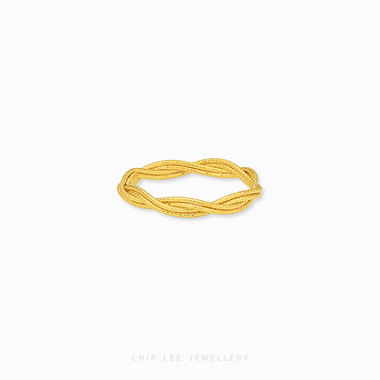 A gold twisted rope bangle bracelet by Chip Lee Jewellery, displayed on a clean white background.