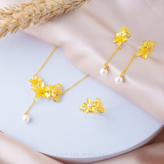 999 Pure Gold Butterfly Pearl Earrings with floral motifs and a pearl accent, crafted in solid gold for timeless elegance and feminine charm.