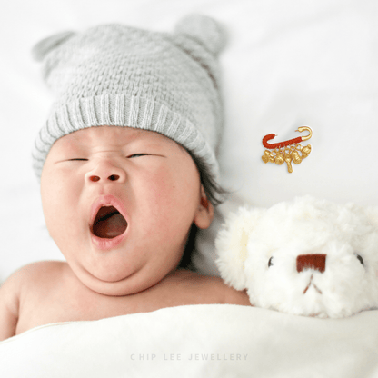 999 Pure Gold Baby Safety Brooch: 24K gold pin with auspicious charms symbolising blessings, safety & prosperity — perfect newborn keepsake.