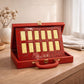 A premium set of 12 Chinese Zodiac bars crafted from 999 pure gold, displayed in two rows within an ornate red collector's case featuring traditional Chinese characters.