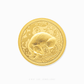 Gold coin with a design of a rat and intricate patterns on a white background