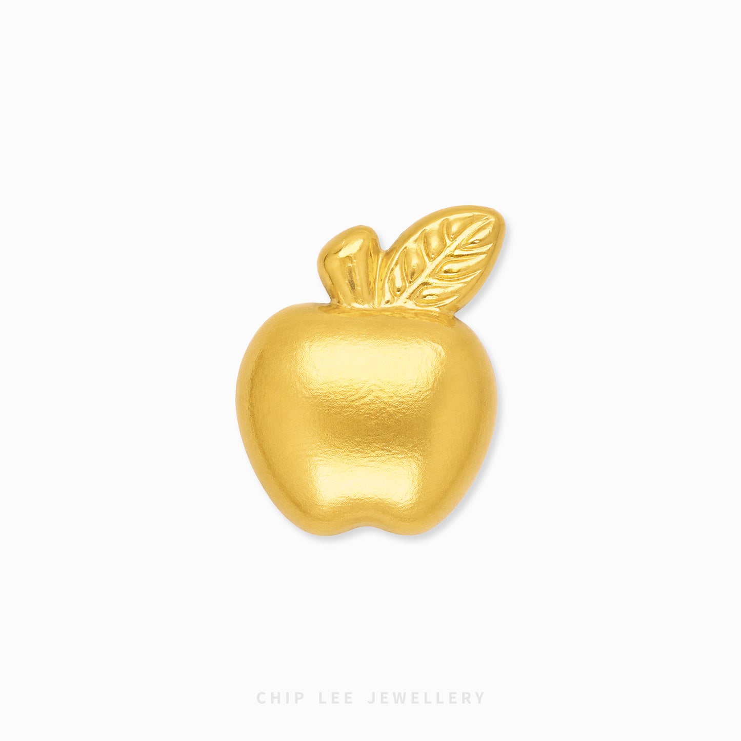 A shiny gold apple-shaped brooch with a textured finish and a leaf detail on top, shown on a plain white background with a faint 'CHIP LEE JEWELLERY' watermark at the bottom.