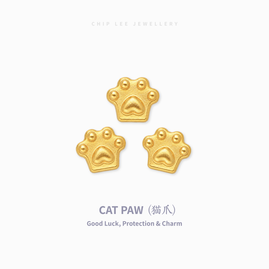 Three small gold cat paw charm pendants arranged in a triangle on a light gray background, with the text 'CHIP LEE JEWELLERY' at the top and 'CAT PAW (猫爪) Good Luck, Protection & Charm' at the bottom.
