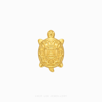 A small gold turtle charm with embossed traditional patterns, centered on a plain white background with 'CHIP LEE JEWELLERY' text at the bottom.