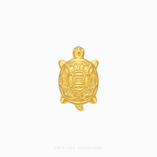 A small gold turtle charm with embossed traditional patterns, centered on a plain white background with 'CHIP LEE JEWELLERY' text at the bottom.