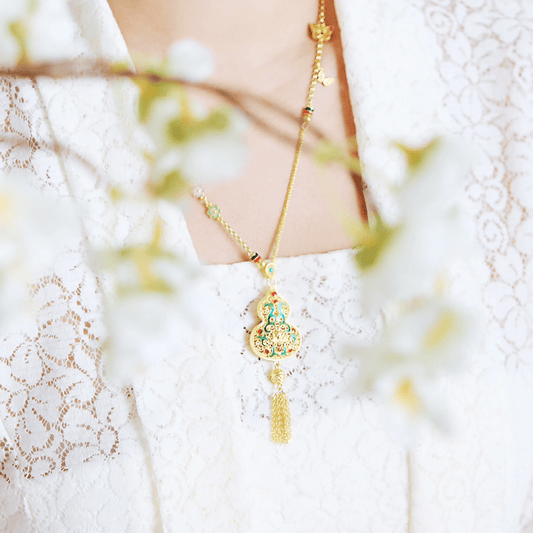 Discover the 999 Pure Gold Abundance & Protection Gourd Gu Fa Jin Necklace, crafted with ancient goldsmithing techniques.