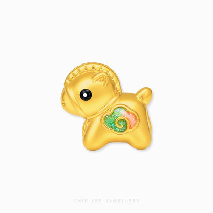 A gold-plated charm shaped like a cute cartoon sheep or goat, featuring a textured gold finish, a small black bead eye, and a colorful enamel heart on its chest with green, pink, and gold swirls. The charm is displayed on a clean white background with a faint 'CHIP LEE JEWELLERY' watermark at the bottom.
