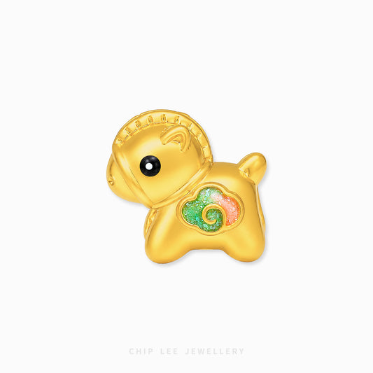 A gold-plated charm shaped like a cute cartoon sheep or goat, featuring a textured gold finish, a small black bead eye, and a colorful enamel heart on its chest with green, pink, and gold swirls. The charm is displayed on a clean white background with a faint 'CHIP LEE JEWELLERY' watermark at the bottom.