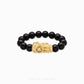 Close-up of 999 Pure Gold 财运亨通 Black Agate Pixiu Bracelet featuring a gold Pixiu charm and black agate beads on display.