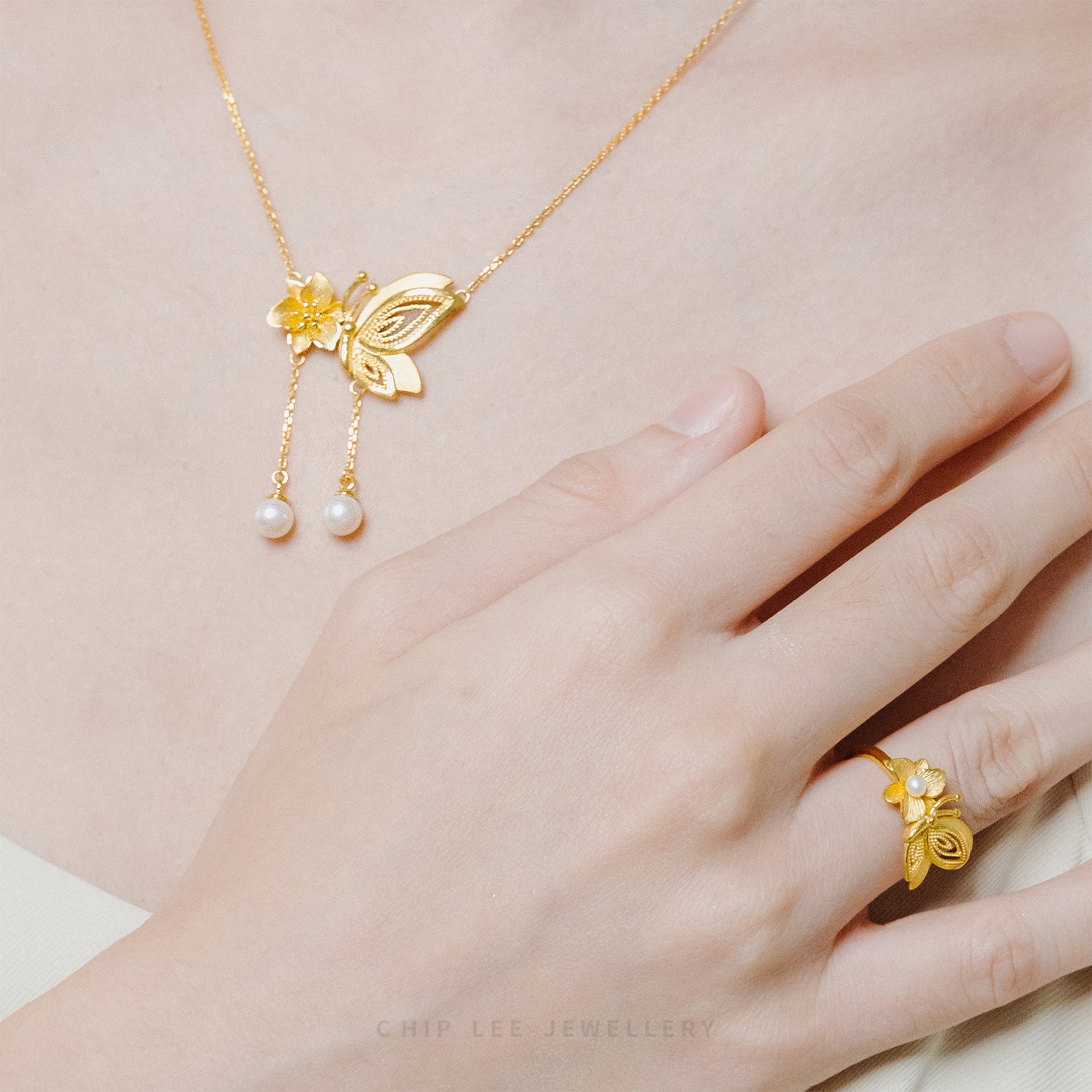 999 Pure Gold Floral Butterfly Pearl Necklace with delicate motifs and a pearl, crafted in solid gold for timeless elegance and charm.
