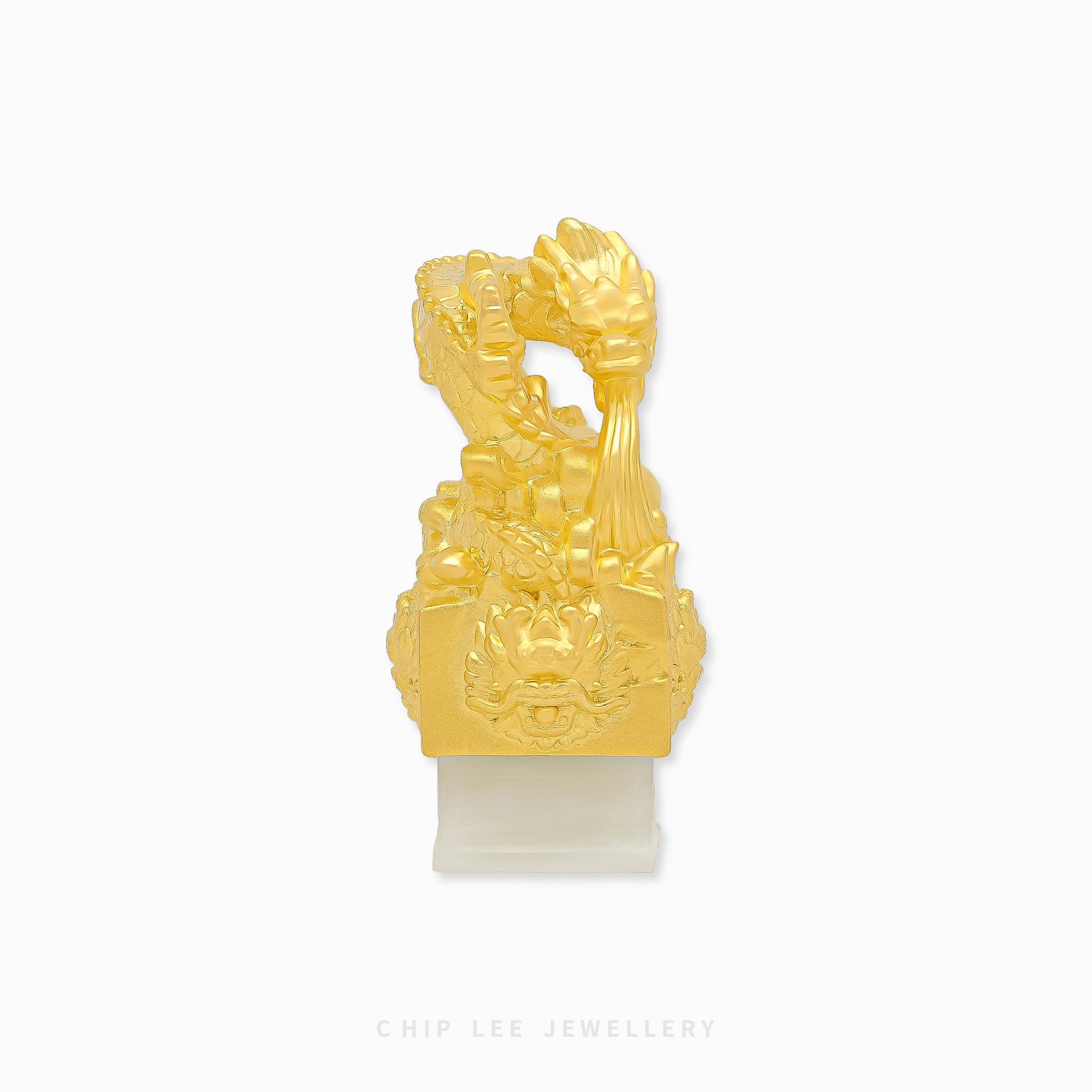 999 pure gold dragon pendant embracing He Tian jade seal, symbolizing power, fortune, protection in a refined traditional jewellery design.
