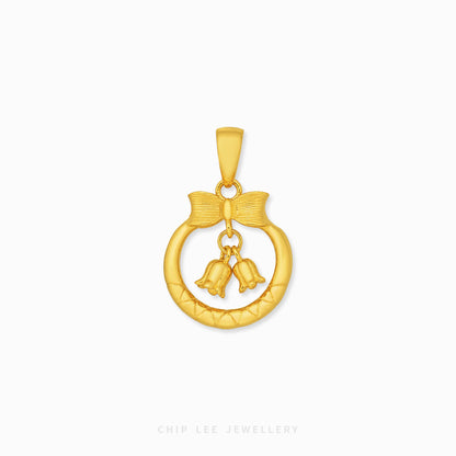 A gold pendant featuring a textured circular ring with a bow detail and two dangling bells, shown on a clean white background with the brand name 'CHIP LEE JEWELLERY' at the bottom.