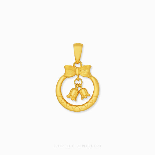A gold pendant featuring a textured circular ring with a bow detail and two dangling bells, shown on a clean white background with the brand name 'CHIP LEE JEWELLERY' at the bottom.
