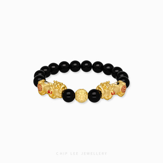 Close-up of 999 Pure Gold Duo Yin Yang Black Agate Pixiu Bracelet with black agate beads and dual Pixiu charms on display.