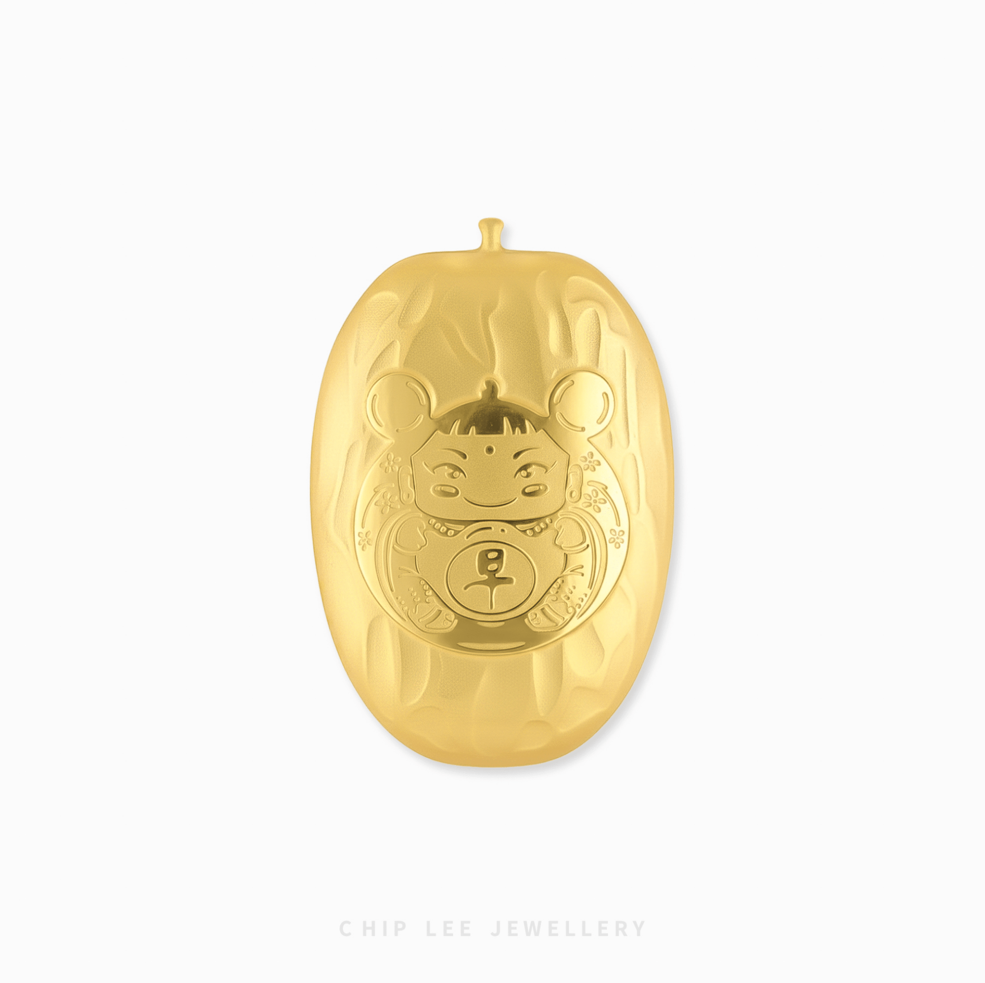 Gold ornament with a face design on a white background