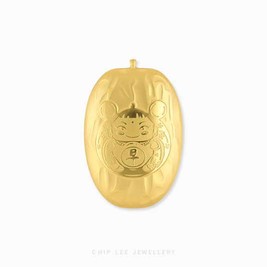 Gold ornament with a face design on a white background