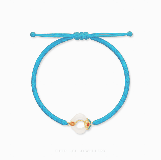 Blue bracelet with a colorful clasp on a white background