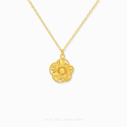 Rose gold necklace with a round pendant on a white background