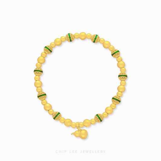 999 Pure Gold Fortune Gourd Gu Fa Jin Bracelet with symbolic gourd charm and green accents, crafted with ancient goldsmithing techniques.