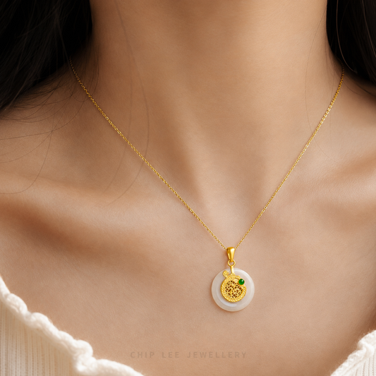 Gold pendant with a green gemstone on a white background, branded 'Chip Lee Jewellery'.
