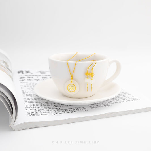 999 pure gold Fu pendant with spinning He Tian jade, symbolizing blessings, good fortune, and tradition in a refined and auspicious jewellery design.