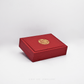 Red jewelry box with gold emblem on a white background