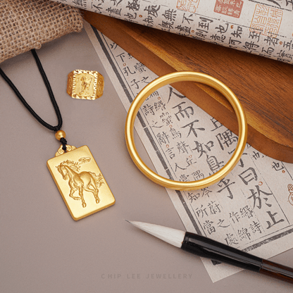 Gold jewelry including a ring, pendant, and bangle crafted ancient goldsmithing techniques.