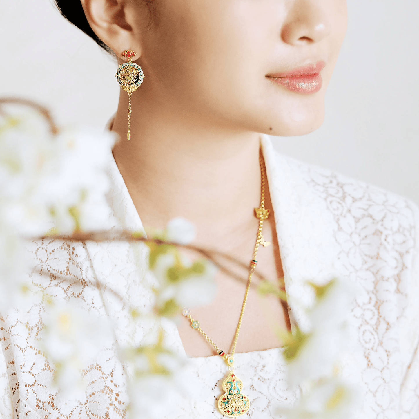 999 pure gold Gu Fa Jin dangling earrings symbolising prosperity and heritage, featuring traditional texture and bold ancient craftsmanship.